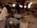 Preparing Mansaf dish at Abou Moussa Mahram. Bedouin camp Sab'aoueya,  West of Mont Nebo-Ma'daba - May 2008